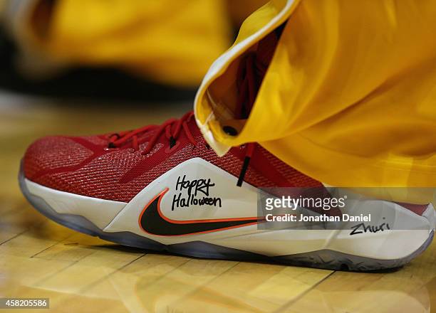 LeBron James of the Cleveland Cavaliers has "Happy Halloween" written on the side of his shoe during a game against the Chicago Bulls at the United...