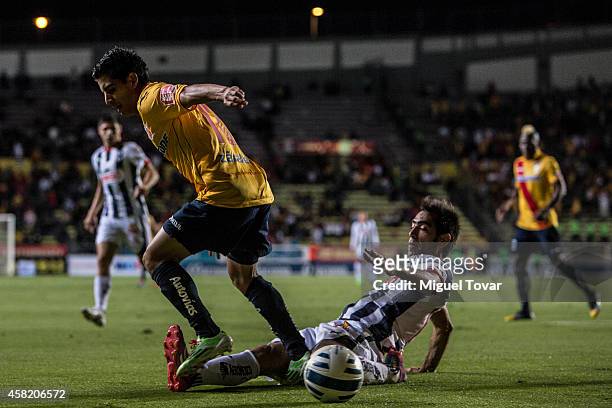 Jorge Zarate of Morelia loses the ball against Cesar Delgado of Monterrey during a match between Morelia and Monterrey as part of 15th round Apertura...