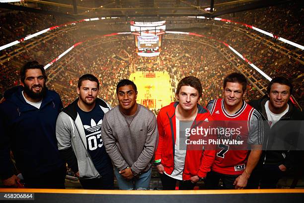 Sam Whitelock, Dane Coles, Malakai Fekitoa, Beauden Barrett, Richie McCaw and Ben Smith pose for a photo as they attend the Chicago Bulls v Cleveland...