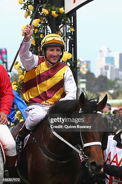 Damien Oliver riding Preferment returns to scale after winning the AAMI Victoria Derby on Derby Day at Flemington Racecourse on November 1, 2014 in...