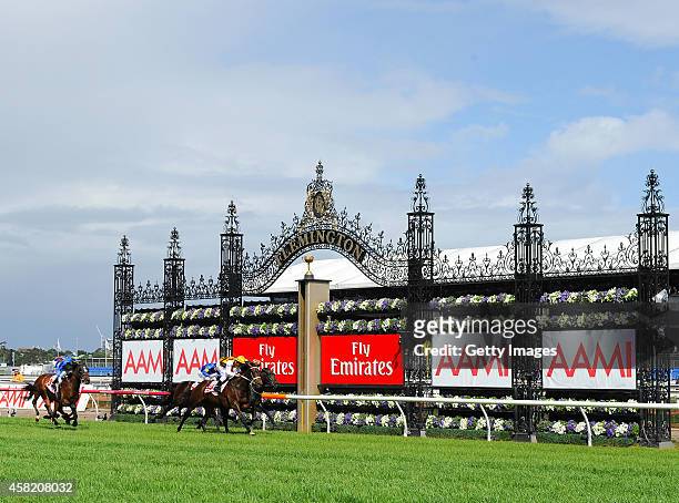 Damien Oliver rides Preferment, to win race seven the AMMI Victoria Derby on Derby Day at Flemington Racecourse on November 1, 2014 in Melbourne,...