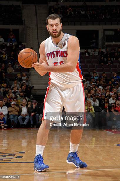 Josh Harrellson of the Detroit Pistons looks to pass the ball against the Charlotte Bobcats on December 20, 2013 at The Palace of Auburn Hills in...
