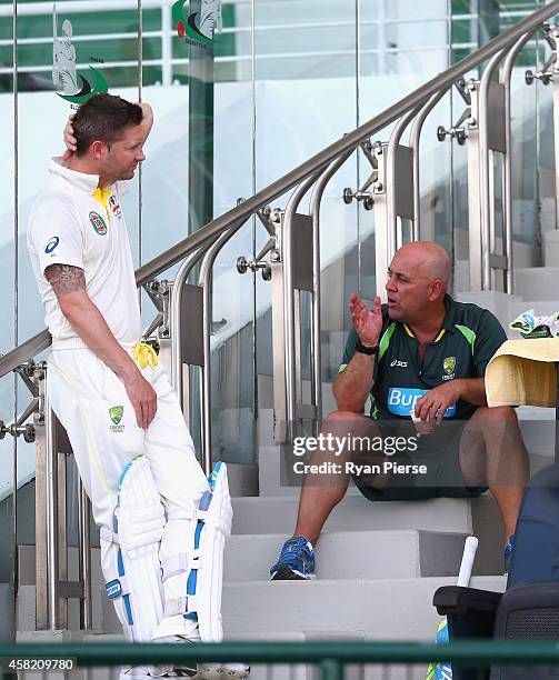 Michael Clarke of Australia speaks to Darren Lehmann, coach of Australia, during Day Two of the Second Test between Pakistan and Australia at Sheikh...