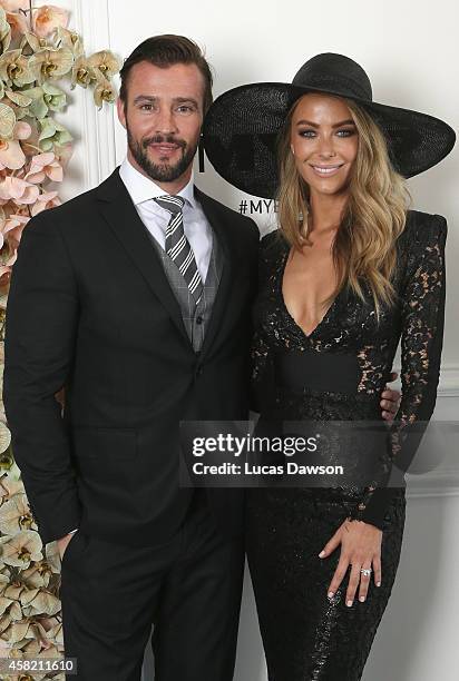 Kris Smith and Jennifer Hawkins at the Myer Marquee on Derby Day at Flemington Racecourse on November 1, 2014 in Melbourne, Australia.