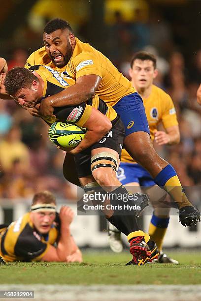 Brynard Stander of Perth Spirit is tackled by Pettowa Paraka of Brisbane City during the 2014 NRC Grand Final match between Brisbane City and Perth...