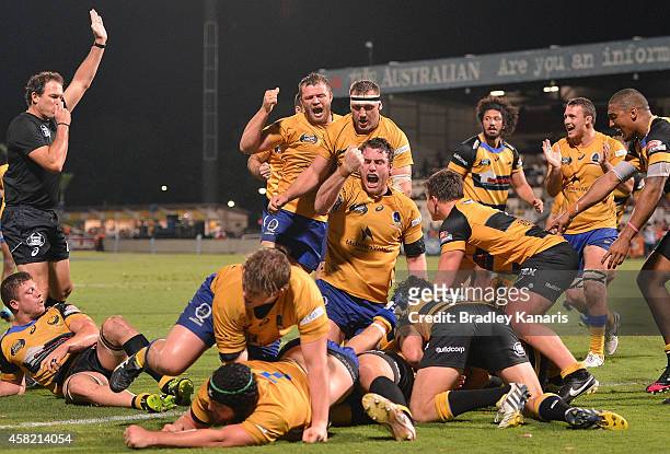Brisbane players celebrate a try by Pettowa Paraka of Brisbane City during the 2014 NRC Grand Final match between Brisbane City and Perth Spirit at...
