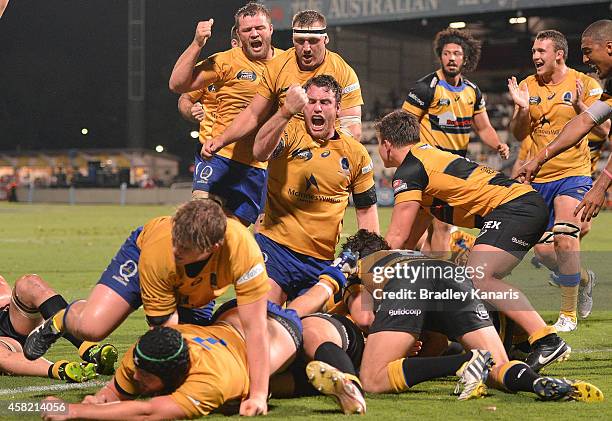 Brisbane players celebrate a try by Pettowa Paraka of Brisbane City during the 2014 NRC Grand Final match between Brisbane City and Perth Spirit at...