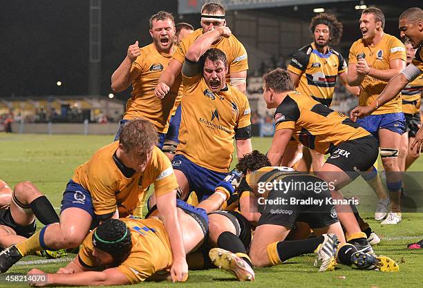 Brisbane players celebrate a try by Pettowa Paraka of Brisbane City during the 2014 NRC Grand Final match between Brisbane City and Perth Spirit at...