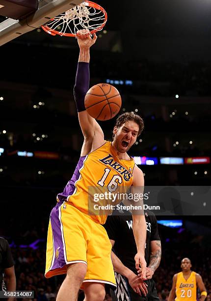Pau Gasol of the Los Angeles Lakers reacts after dunking against the Minnesota Timberwolves at Staples Center on December 20, 2013 in Los Angeles,...