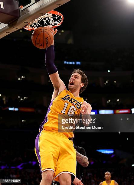 Pau Gasol of the Los Angeles Lakers dunks against the Minnesota Timberwolves at Staples Center on December 20, 2013 in Los Angeles, California. The...