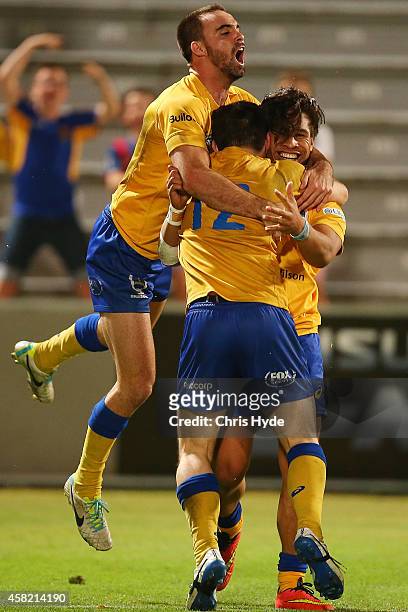 Junior Laloifi of Brisbane City celebrates a try with team mates during the 2014 NRC Grand Final match between Brisbane City and Perth Spirit at...