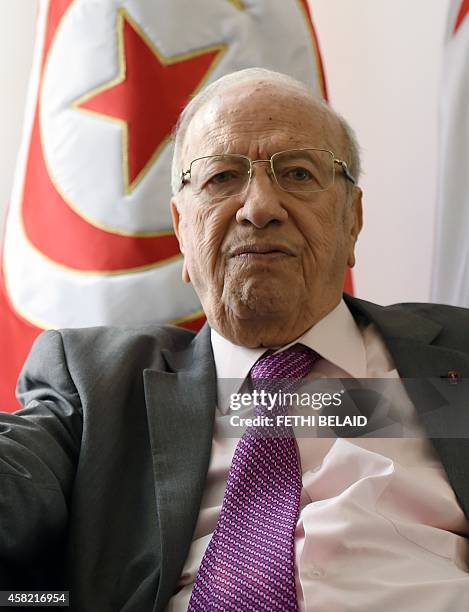 Tunisian leader of the main anti-Islamist party Nidaa Tounes and presidential candidate, Beji Caid Essebsi listens to AFP journalists' questions...