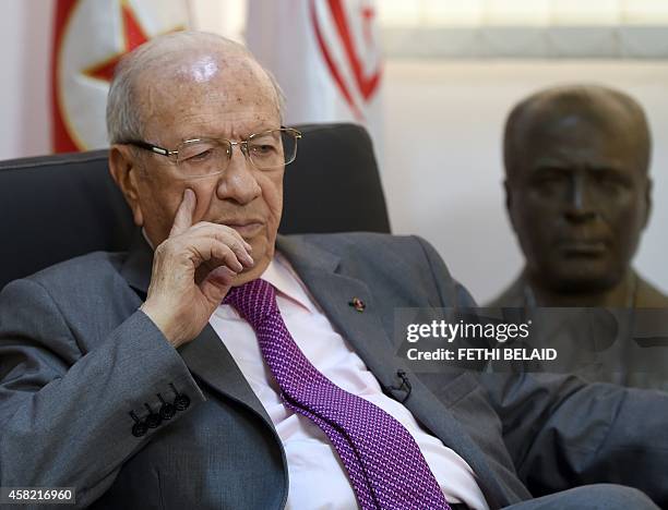 Tunisian leader of the main anti-Islamist party Nidaa Tounes and presidential candidate, Beji Caid Essebsi listens to AFP journalists' questions...