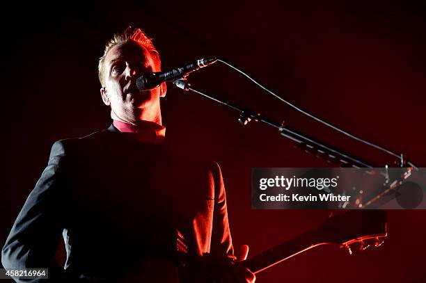 Musician Josh Homme of Queens of The Stone Age performs at the Forum on October 31, 2014 in Inglewood, California.