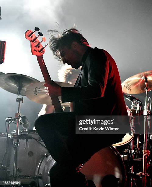 Musician Michael Shuman of Queens of The Stone Age performs at the Forum on October 31, 2014 in Inglewood, California.