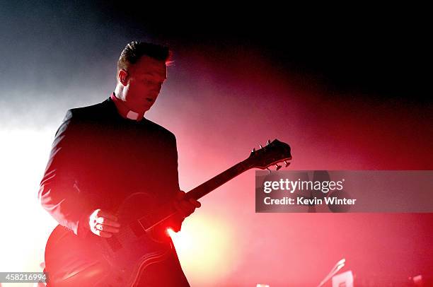 Musician Josh Homme of Queens of The Stone Age performs at the Forum on October 31, 2014 in Inglewood, California.