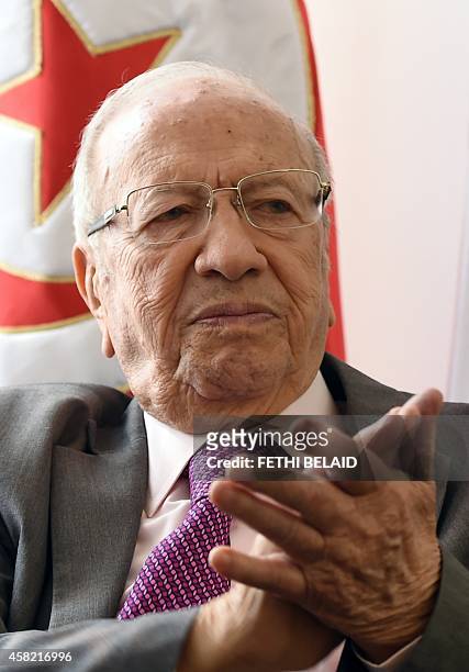 Tunisian leader of the main anti-Islamist party Nidaa Tounes and presidential candidate, Beji Caid Essebsi listens to AFP journalists' questions...