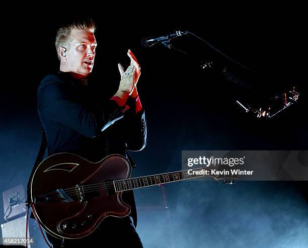 Musician Josh Homme of Queens of The Stone Age performs at the Forum on October 31, 2014 in Inglewood, California.