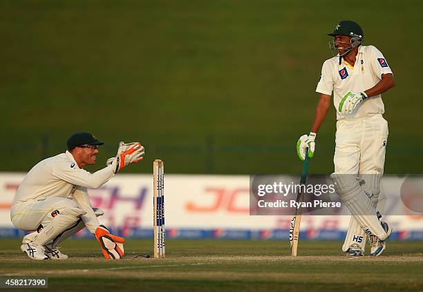 David Warner of Australia and Younis Khan of Pakistan share a joke during Day Three of the Second Test between Pakistan and Australia at Sheikh Zayed...