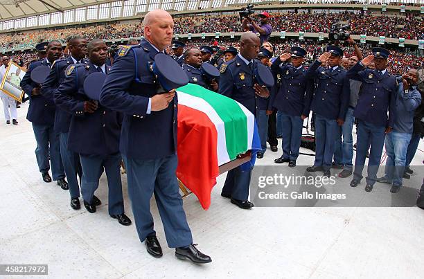 Senzo Meyiwa's coffin is brought in by the SAPS members during the funeral service of the late Senzo Meyiwa at Moses Mabhida Stadium on November 01,...