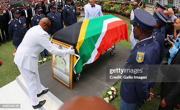 Senzo Meyiwa's coffin is brought in by the SAPS members during the funeral service of the late Senzo Meyiwa at Moses Mabhida Stadium on November 01,...