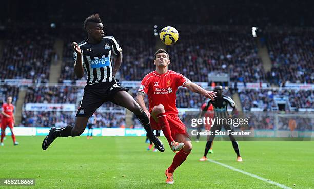 Newcastle player Sammy Ameobi challenges Dejan Lovren during the Barclays Premier League match between Newcastle United and Liverpool at St James'...