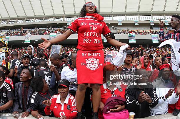 Fans express their emotions during the funeral service of the late Senzo Meyiwa at Moses Mabhida Stadium on November 01, 2014 in Durban, South...