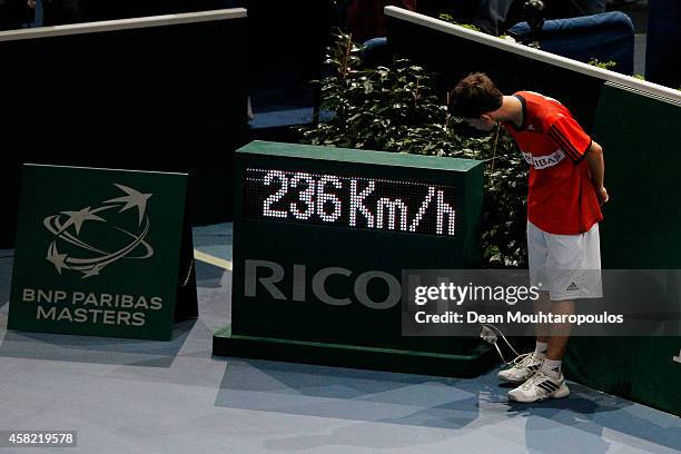 Ball boy looks at the radar display and the 236km serve speed by Milos Raonic of Canada against Tomas Berdych of Czech Republic in their semi final...