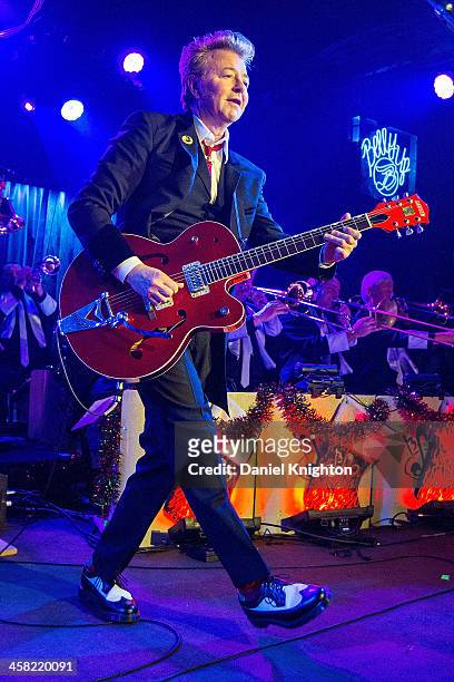 Brian Setzer performs with The Brian Setzer Orchestra during their Christmas Rocks 10th Anniversary Tour at Belly Up Tavern on December 20, 2013 in...