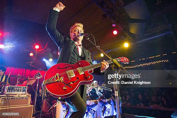 Brian Setzer performs with The Brian Setzer Orchestra during their Christmas Rocks 10th Anniversary Tour at Belly Up Tavern on December 20, 2013 in...