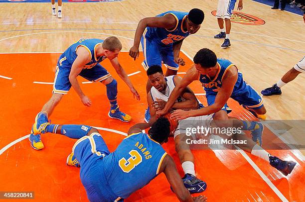 Jabari Parker of the Duke Blue Devils battles to keep the ball against Jordan Adams, Bryce Alford, Tony Parker and Kyle Anderson of the UCLA Bruins...