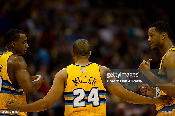 Andre Miller of the Denver Nuggets speaks to teammates Darrell Arthur and Anthony Randolph during an NBA game against the Phoenix Suns at the Pepsi...
