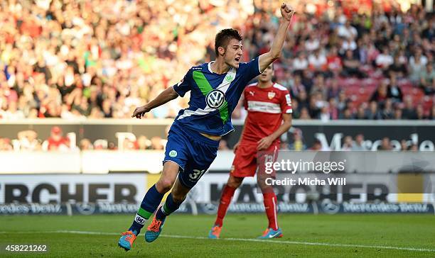 Robin Knoche of Wolfsburg celebrates after scoring his team's second goal during the Bundesliga match between VfB Stuttgart and VfL Wolfsburg at...