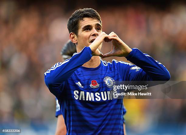 Oscar of Chelsea celebrates scoring the opening goal during the Barclays Premier League match between Chelsea and Queens Park Rangers at Stamford...