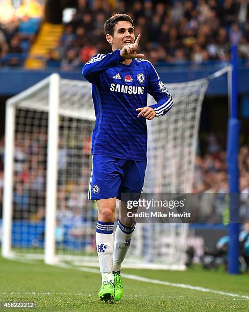 Oscar of Chelsea celebrates scoring the opening goal during the Barclays Premier League match between Chelsea and Queens Park Rangers at Stamford...