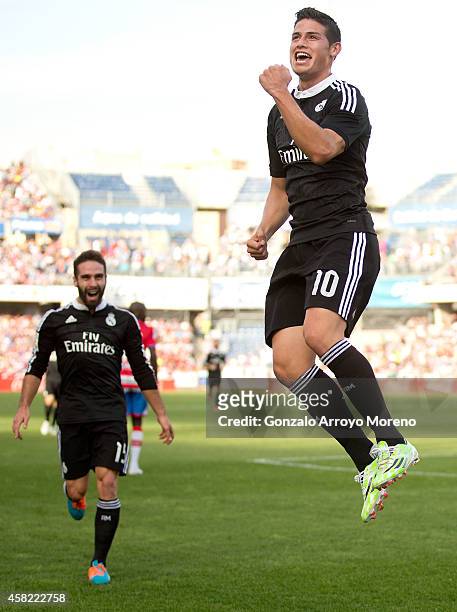 James Rodriguez of Real Madrid CF celebrates scoring their second goal during the La Liga match between Granada CF and Real Madrid CF at Nuevo...