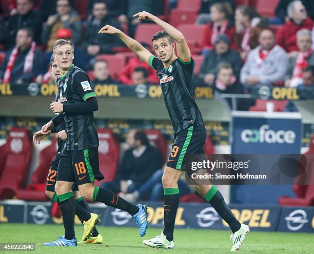 Franco di Santo of Bremen celebrates his team's second goal with his team mate Felix Kroos during the Bundesliga match between 1. FSV Mainz 05 and SV...