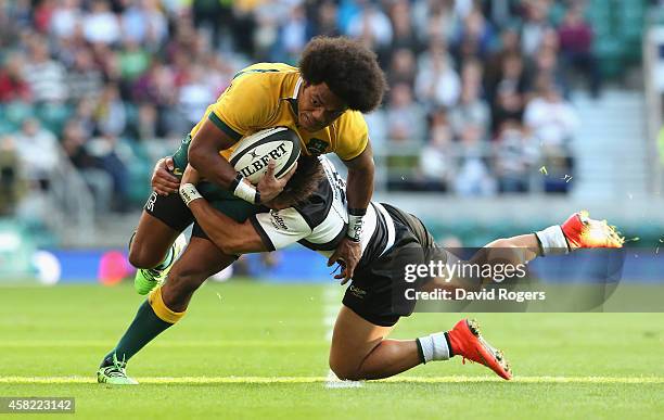 Henry Speight of Australia is tackled by Tim Nanai-Williams during the Killick Cup match between the Barbarians and Australian Wallabies at...