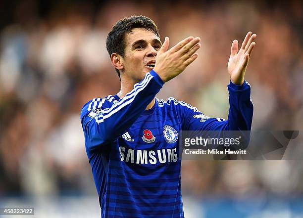 Oscar of Chelsea celebrates scoring the opening goal during the Barclays Premier League match between Chelsea and Queens Park Rangers at Stamford...