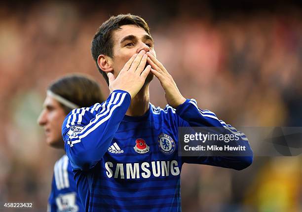 Oscar of Chelsea celebrates scoring the opening goal during the Barclays Premier League match between Chelsea and Queens Park Rangers at Stamford...