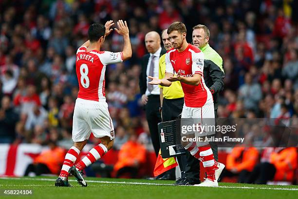 Mikel Arteta of Arsenal is substituted for Aaron Ramsey of Arsenal during the Barclays Premier League match between Arsenal and Burnley at Emirates...