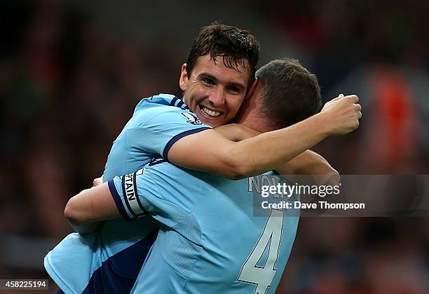 Stewart Downing of West Ham celebrates scoring his team's second goal with team-mate Kevin Nolan during the Barclays Premier League match between...