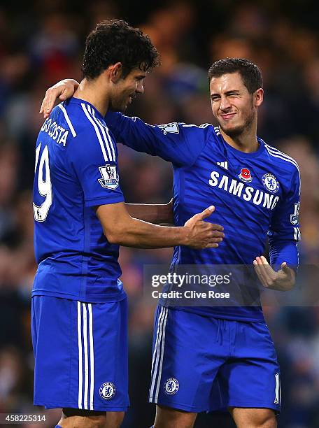 Eden Hazard of Chelsea celebrates his goal with Diego Costa during the Barclays Premier League match between Chelsea and Queens Park Rangers at...