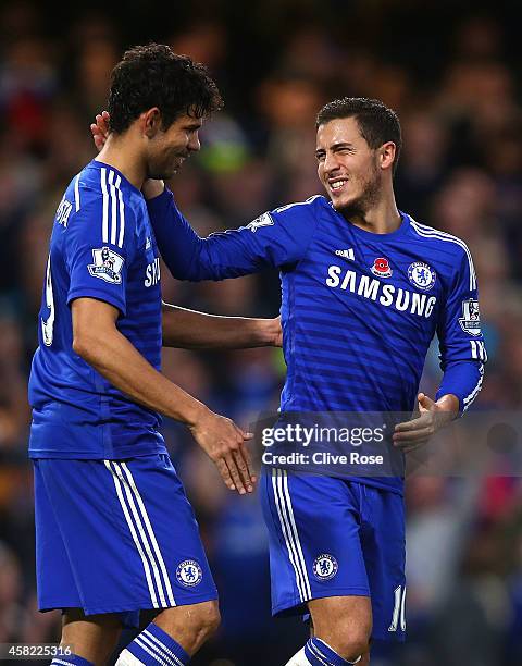 Eden Hazard of Chelsea celebrates his goal with Diego Costa during the Barclays Premier League match between Chelsea and Queens Park Rangers at...