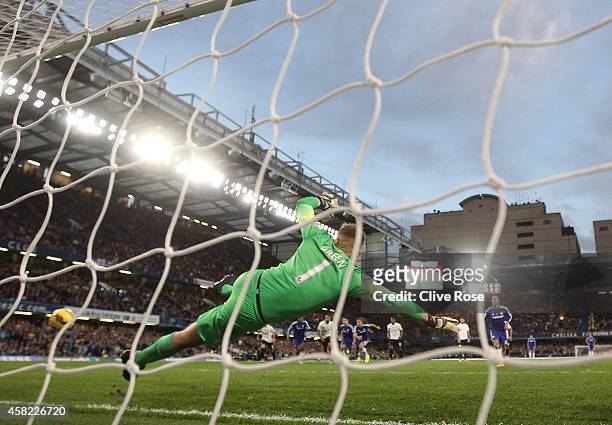 Robert Green of Queens Park Rangers fails to save a goal by Eden Hazard of Chelsea during the Barclays Premier League match between Chelsea and...