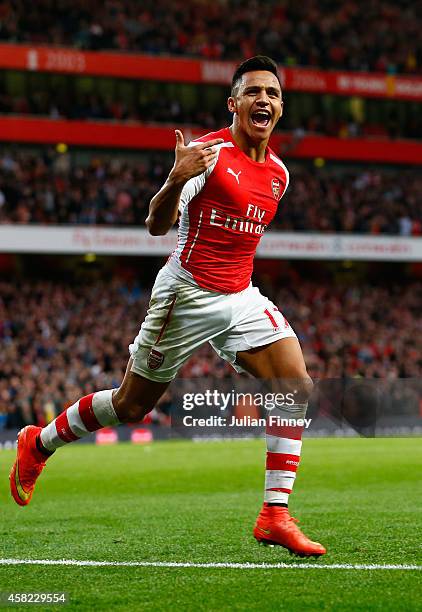 Alexis Sanchez of Arsenal celebrates scoring the first goal during the Barclays Premier League match between Arsenal and Burnley at Emirates Stadium...