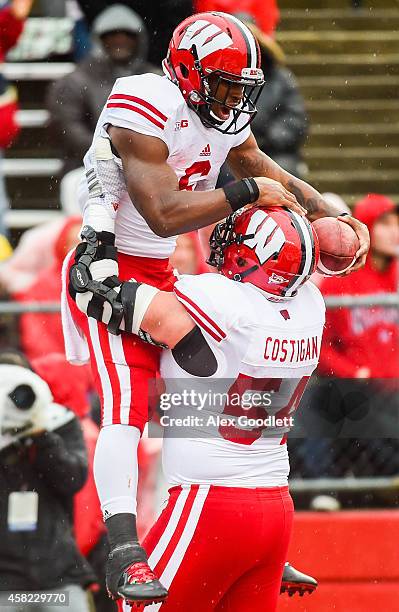 Corey Clement of the Wisconsin Badgers celebrates with Kyle Costigan after scoring a touchdown in the second quarter at High Point Solutions Stadium...