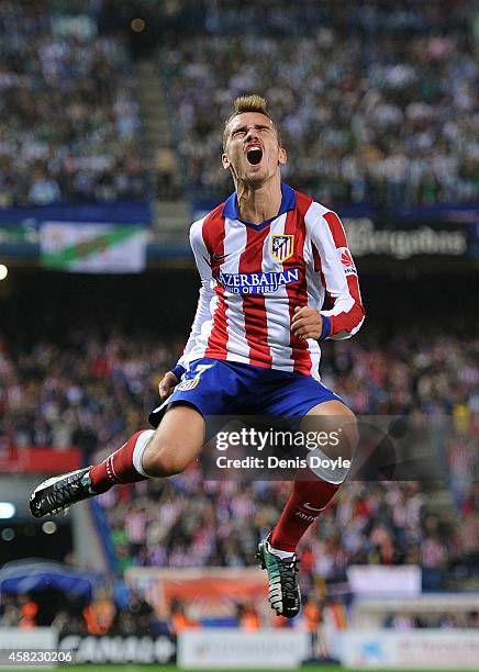 Antoine Griezmann of Club Atletico de Madrid celebrates after scoring his team's opening goal during the La Liga match between Club Atletico de...