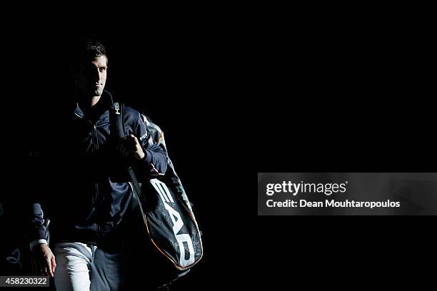 Novak Djokovic of Serbia walk out to play against against Kei Nishikori of Japan in their semi final match during day 6 of the BNP Paribas Masters...