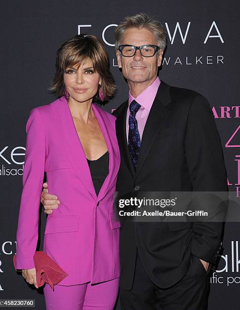 Actors Lisa Rinna and Harry Hamlin arrive at the 10th Annual Pink Party held at Santa Monica Airport on October 18, 2014 in Santa Monica, California.